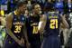 KANSAS CITY, MO - MARCH 24: (L-R) Rohan Brown #35, Sam Mills #10 and Tyrone Garland #21 of the La Salle Explorers celebrate after Garland made the game winning shot to give them a 76-74 win against the Mississippi Rebels during the third round of the 2013 NCAA Men's Basketball Tournament at Sprint Center on March 24, 2013 in Kansas City, Missouri. (Photo by Ed Zurga/Getty Images)