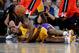 Mar 22, 2013; Los Angeles, CA, USA; Los Angeles Lakers small forward Metta World Peace (15) goes for a loose ball during the first half of the game against the Washington Wizards at the Staples Center. Mandatory Credit: Jayne Kamin-Oncea-USA TODAY Sports