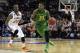 Oregon's Carlos Emory driving the ball in against No. 5 seed Oklahoma State
