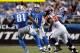 DETROIT, MI - DECEMBER 22: Matthew Stafford #9 of the Detroit Lions throws a second quarter pass to Calvin Johnson #81 while playing the Atlanta Falcons at Ford Field on December 22, 2012 in Detroit, Michigan. Atlanta won the game 31-18. (Photo by Gregory Shamus/Getty Images)