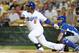 GLENDALE, AZ - MARCH 15: Juan Uribe #5 of the Los Angeles Dodgers follows through on a swing against the Kansas City Royals on March 15, 2013 in Glendale, Arizona. (Photo by Norm Hall/Getty Images)