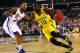 ARLINGTON, TX - MARCH 29: Tim Hardaway Jr. #10 of the Michigan Wolverines drives against Travis Releford #24 of the Kansas Jayhawks during the South Regional Semifinal round of the 2013 NCAA Men's Basketball Tournament at Dallas Cowboys Stadium on March 29, 2013 in Arlington, Texas. (Photo by Ronald Martinez/Getty Images)