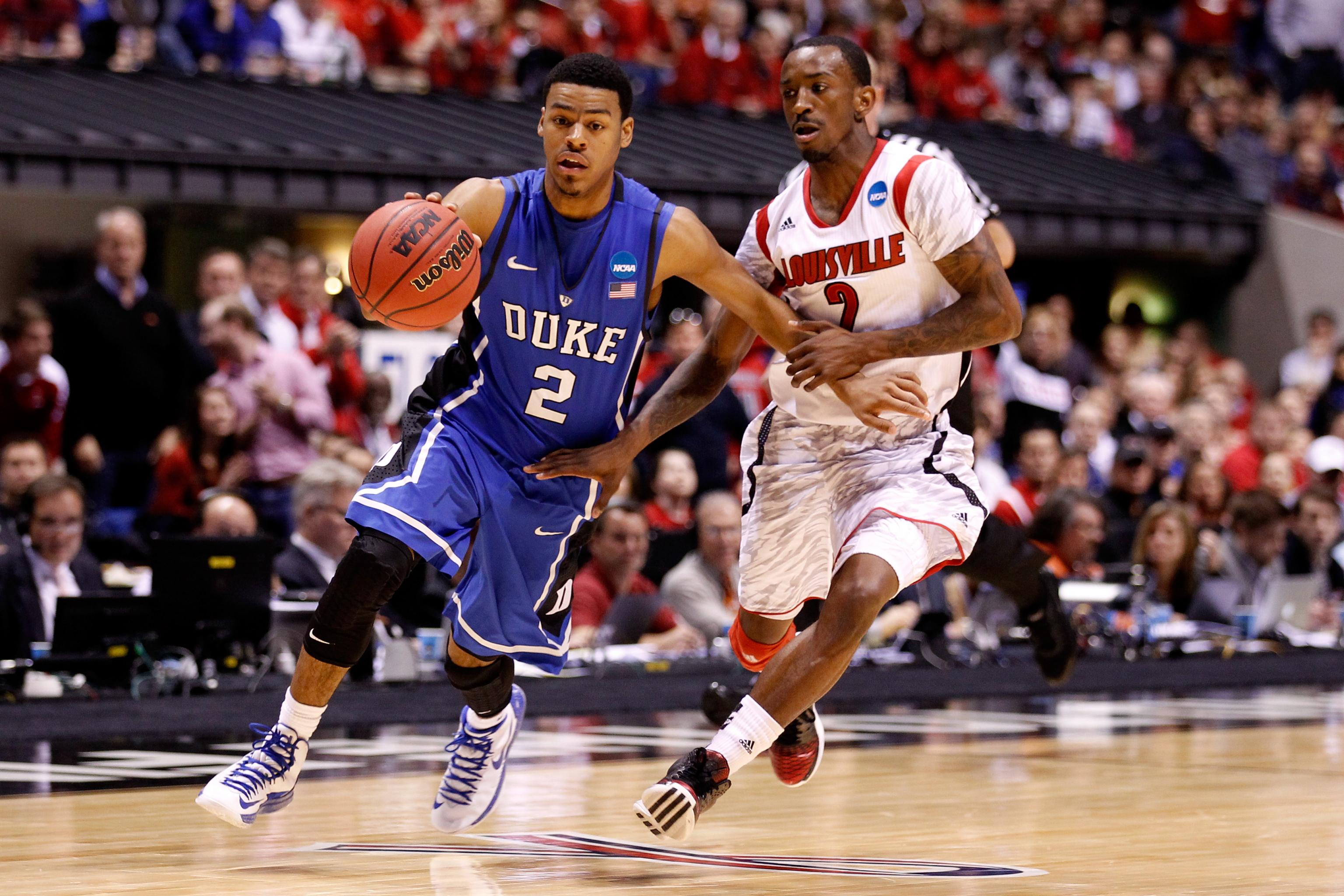 Mason Faulkner of the Louisville Cardinals brings the ball up court News  Photo - Getty Images