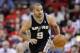 Mar 24, 2013; Houston, TX, USA; San Antonio Spurs point guard Tony Parker (9) leads a fast break against the Houston Rockets during the second half at the Toyota Center. The Rockets won 96-95. Mandatory Credit: Thomas Campbell-USA TODAY Sports
