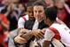 INDIANAPOLIS, IN - MARCH 31: (L-R) Chane Behanan #21, head coach Rick Pitino and Russ Smith #2 of the Louisville Cardinals celebrate in the final minute as they won 85-63 against the Duke Blue Devils during the Midwest Regional Final round of the 2013 NCAA Men's Basketball Tournament at Lucas Oil Stadium on March 31, 2013 in Indianapolis, Indiana. (Photo by Andy Lyons/Getty Images)