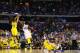 ARLINGTON, TX - MARCH 29: Trey Burke #3 of the Michigan Wolverines shoots a game tying three pointer in the final seconds of the second half over Kevin Young #40 of the Kansas Jayhawks during the South Regional Semifinal round of the 2013 NCAA Men's Basketball Tournament at Dallas Cowboys Stadium on March 29, 2013 in Arlington, Texas. (Photo by Ronald Martinez/Getty Images)