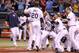 April 3, 2012; St. Petersburg, FL, USA; Tampa Bay Rays right fielder Matt Joyce (20) is congratulated by teammates at home plate after he hit a walk off home run against the Baltimore Orioles during the ninth inning at Tropicana Field. Tampa Bay Rays defeated the Baltimore Orioles 8-7. Mandatory Credit: Kim Klement-USA TODAY Sports