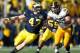 ANN ARBOR, MI - NOVEMBER 17: Jake Ryan #47 of the Michigan Wolverines tries to avoid a block from Mark Weisman #45 of the Iowa Hawkeyes at Michigan Stadium on November 17, 2012 in Ann Arbor, Michigan. Michigan won the game 42-17. (Photo by Gregory Shamus/Getty Images)