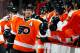 PHILADELPHIA, PA - MARCH 31: Kimmo Timonen #44 of the Philadelphia Flyers is congratulated by teammates after he scored a goal to tie the game late in the third period of an NHL hockey game against the Washington Capitals at Wells Fargo Center on March 31, 2013 in Philadelphia, Pennsylvania. Flyers won 5-4 in overtime. (Photo by Paul Bereswill/Getty Images)