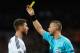 MADRID, SPAIN - APRIL 03: Referee Svein Oddvar Moen shows the yellow card to Sergio Ramos of Real Madrid during the UEFA Champions League Quarter Final first leg match between Real Madrid and Galatasaray at Estadio Santiago Bernabeu on April 3, 2013 in Madrid, Spain. (Photo by Manuel Queimadelos Alonso/Getty Images)