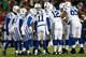 FOXBORO, MA - NOVEMBER 18: Andrew Luck #12 of the Indianapolis Colts runs huddles with his team against the New England Patriots during the game on November 18, 2012 at Gillette Stadium in Foxboro, Massachusetts. (Photo by Jared Wickerham/Getty Images)
