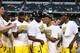 ARLINGTON, TX - MARCH 31: The Michigan Wolverines celebrate their 79 to 59 win over the Florida Gators during the South Regional Round Final of the 2013 NCAA Men's Basketball Tournament at Dallas Cowboys Stadium on March 31, 2013 in Arlington, Texas. (Photo by Ronald Martinez/Getty Images)
