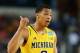 Mar 29, 2013; Arlington, TX, USA; Michigan Wolverines guard Trey Burke (3) reacts during the game against the Kansas Jayhawks during the semifinals of the South regional of the 2013 NCAA Tournament at Cowboys Stadium. Mandatory Credit: Kevin Jairaj-USA TODAY Sports