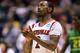 INDIANAPOLIS, IN - MARCH 29: Russ Smith #2 of the Louisville Cardinals reacts after they won 77-69 against the Oregon Ducks during the Midwest Region Semifinal round of the 2013 NCAA Men's Basketball Tournament at Lucas Oil Stadium on March 29, 2013 in Indianapolis, Indiana. (Photo by Andy Lyons/Getty Images)