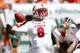 MIAMI GARDENS, FL - SEPTEMBER 29: Mike Glennon #8 of the North Carolina State Wolfpack throws the ball against the Miami Hurricanes on September 29, 2012 at Sun Life Stadium in Miami Gardens, Florida. (Photo by Joel Auerbach/Getty Images)