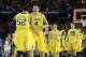 Apr 6, 2013; Atlanta, GA, USA; Michigan Wolverines forward Mitch McGary (4) celebrates with forward Jordan Morgan (52) after defeating the Syracuse Orange 61-56 in the semifinals during the 2013 NCAA mens Final Four at the Georgia Dome. Mandatory Credit: Robert Deutsch-USA TODAY Sports
