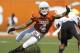 AUSTIN, TX - OCTOBER 15: Safety Kenny Vaccaro #4 of the Texas Longhorns attempts a first quarter tackle of running back Joseph Randall #1 of the Oklahoma State Cowboys on October 15, 2011 at Darrell K. Royal-Texas Memorial Stadium in Austin, Texas. Oklahoma State beat Texas 38-26. (Photo by Erich Schlegel/Getty Images)