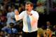 NEW ORLEANS, LA - APRIL 07: Geno Auriemma, head coach of the Connecticut Huskies, instructs his team against the Notre Dame Fighting Irish during the National Semifinal game of the 2013 NCAA Division I Women's Basketball Championship at New Orleans Arena on April 7, 2013 in New Orleans, Louisiana. Connecticut won the game 83-65. (Photo by Stacy Revere/Getty Images)