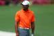 AUGUSTA, GA - APRIL 08: Tiger Woods of the United States looks on from practice range during a practice round prior to the start of the 2013 Masters Tournament at Augusta National Golf Club on April 8, 2013 in Augusta, Georgia. (Photo by Mike Ehrmann/Getty Images)