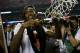 ATLANTA, GA - APRIL 08: Injured guard Kevin Ware #5 of the Louisville Cardinals celebrates as he cuts down the net after Louisville won 82-76 against the Michigan Wolverines during the 2013 NCAA Men's Final Four Championship at the Georgia Dome on April 8, 2013 in Atlanta, Georgia. (Photo by Streeter Lecka/Getty Images)