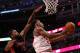 CHICAGO, IL - APRIL 09: Jimmy Butler #21 of the Chicago Bulls puts up a shot in front of Amir Johnson #15 of the Toronto Raptors on his way to a game-high 28 points at the United Center on April 9, 2013 in Chicago, Illinois. The Raptors defeated the Bulls 101-98. NOTE TO USER: User expressly acknowledges and agrees that, by downloading and or using this photograph, User is consenting to the terms and conditions of the Getty Images License Agreement. (Photo by Jonathan Daniel/Getty Images)