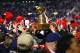 Nov 24, 2012; Oxford, MS, USA; Mississippi Rebels fans celebrate by holding up the Egg Bowl trophy after their victory against the Mississippi State Bulldogs at Vaught-Hemingway Stadium. Mississippi Rebels defeated the Mississippi State Bulldogs 41-24. Mandatory Credit: Spruce Derden-USA TODAY Sports