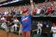 ARLINGTON, TX - APRIL 7: Texas A&M quarterback and Heisman Trophy winner Johnny Manziel acknowledges the crowd as he takes the field to throw the first pitch of a baseball game against the Los Angeles Angels of Anaheim at Rangers Ballpark in Arlington on April 7, 2013 in Arlington, Texas. (Photo by Brandon Wade/Getty Images)
