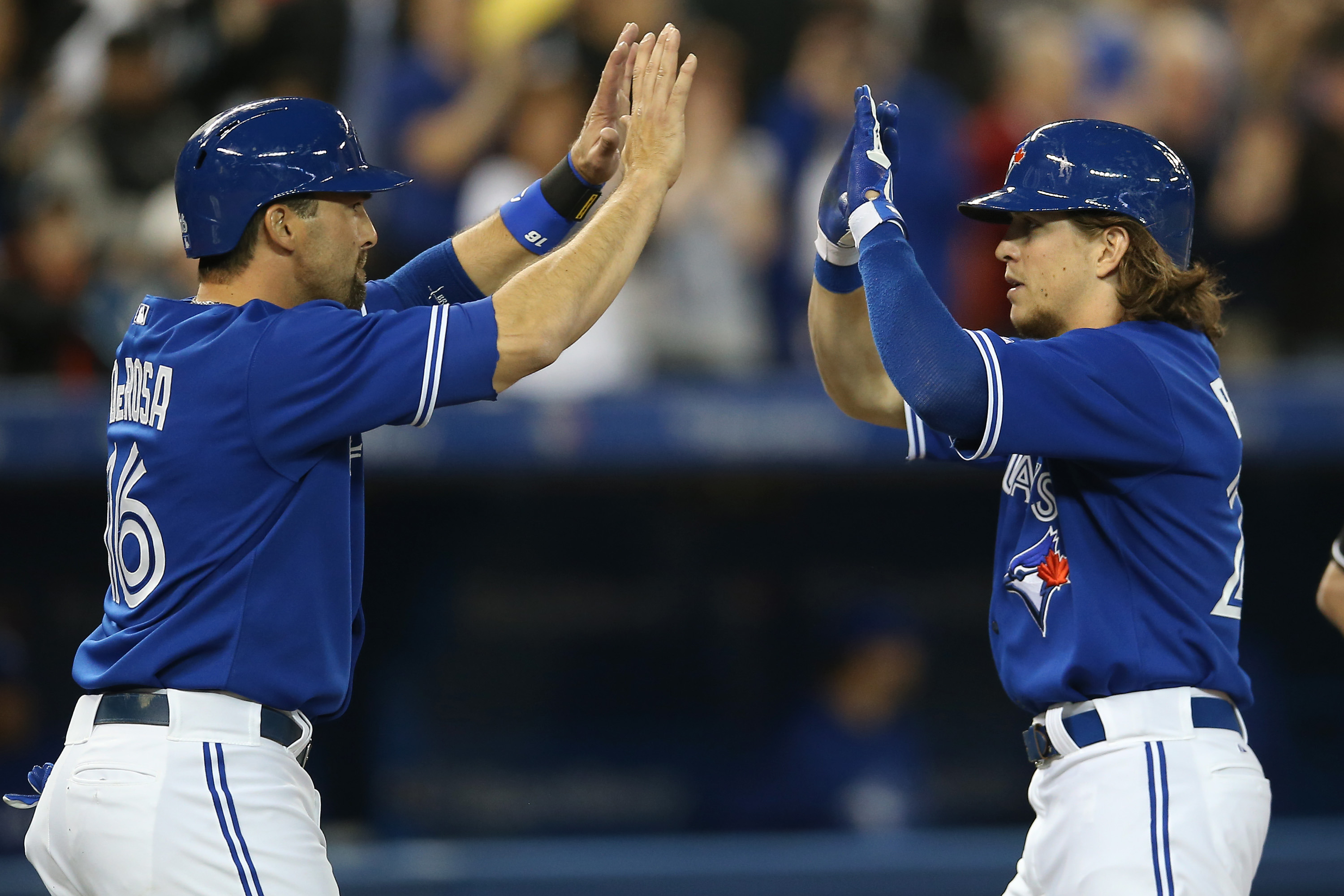 Toronto Blue Jays' Munenori Kawasaki runs to first base after