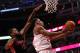 CHICAGO, IL - APRIL 09: Jimmy Butler #21 of the Chicago Bulls puts up a shot in front of Amir Johnson #15 of the Toronto Raptors on his way to a game-high 28 points at the United Center on April 9, 2013 in Chicago, Illinois. The Raptors defeated the Bulls 101-98. NOTE TO USER: User expressly acknowledges and agrees that, by downloading and or using this photograph, User is consenting to the terms and conditions of the Getty Images License Agreement. (Photo by Jonathan Daniel/Getty Images)