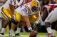 BATON ROUGE, LA - NOVEMBER 25: Quarterback Jordan Jefferson #9 of the LSU Tigers under center as he waits for a snap from center P.J. Lonergan #64 in the second quarter against the Arkansas Razorbacks at Tiger Stadium on November 25, 2011 in Baton Rouge, Louisiana. (Photo by Chris Graythen/Getty Images)