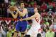 Mar 17, 2013; Houston, TX, USA; Golden State Warriors center Andrew Bogut (12) controls the ball during the second half as Houston Rockets center Omer Asik (3) defends at Toyota Center. Mandatory Credit: Troy Taormina-USA TODAY Sports