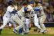 Apr 11, 2013; San Diego, CA, USA; San Diego Padres left fielder Carlos Quentin (middle right) and Los Angeles Dodgers starting pitcher Zack Greinke (middle left) tangle as Dodgers catcher A.J. Ellis (17) and shortstop Justin Sellers (28) and Padres first baseman Yonder Alonso (left) join in the bench clearing fight during the sixth inning after Quentin was hit by a pitch at PETCO Park. Mandatory Credit: Jake Roth-USA TODAY Sports