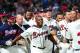 ATLANTA, GA - APRIL 6: Justin Upton #8 of the Atlanta Braves is congratulated by teammates after his ninth inning game-winning home run against the Chicago Cubs at Turner Field on April 6, 2013 in Atlanta, Georgia. (Photo by Scott Cunningham/Getty Images)