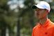 Tianlang Guan became the youngest golfer to ever make a cut in a major championship at Augusta National on Friday.