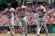 WASHINGTON, DC - APRIL 14: Justin Upton #8 (L) and Evan Gattis #24 (C) celebrate with teammate Andrelton Simmons #19 of the Atlanta Braves after they both scored during the first inning against the Washington Nationals at Nationals Park on April 14, 2013 in Washington, DC. (Photo by Rob Carr/Getty Images)