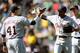 OAKLAND, CA - APRIL 14: Austin Jackson #14 and Victor Martinez #41 of the Detroit Tigers celebrates defeating the Oakland Athletics by a score of 10-1 at O.co Coliseum on April 14, 2013 in Oakland, California. (Photo by Thearon W. Henderson/Getty Images)