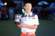 AUGUSTA, GA - APRIL 14: Tianlang Guan of China poses after winning low amateur honors after the final round of the 2013 Masters Tournament at Augusta National Golf Club on April 14, 2013 in Augusta, Georgia. (Photo by Mike Ehrmann/Getty Images)