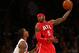NEW YORK, NY - JANUARY 27: Josh Smith #5 of the Atlanta Hawks passes the ball as J.R. Smith #8 of the New York Knicks defends on January 27, 2013 at Madison Square Garden in New York City. The New York Knicks defeated the Atlanta Hawks 106-104. NOTE TO USER: User expressly acknowledges and agrees that, by downloading and/or using this photograph, user is consenting to the terms and conditions of the Getty Images License Agreement. (Photo by Elsa/Getty Images)
