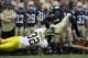 SOUTH BEND, IN - SEPTEMBER 11: Cierre Wood #20 of the Notre Dame Fighting Irish is tackled by Jordan Kovacs #32 of the Michigan Wolverines at Notre Dame Stadium on September 11, 2010 in South Bend, Indiana. Michigan defeated Notre Dame 28-24. (Photo by Jonathan Daniel/Getty Images)
