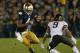 SOUTH BEND, IN - NOVEMBER 17: George Atkinson II #4 of the Notre Dame Fighting Irish moves against Kevin Johnson #9 of the Wake Forest Demon Deacons at Notre Dame Stadium on November 17, 2012 in South Bend, Indiana. Notre Dame defeated Wake Forest 38-0. (Photo by Jonathan Daniel/Getty Images)