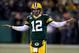GREEN BAY, WI - JANUARY 05: Quarterback Aaron Rodgers #12 of the Green Bay Packers reacts on the field during pregame warm ups before taking on the Minnesota Vikings in the NFC Wild Card Playoff game at Lambeau Field on January 5, 2013 in Green Bay, Wisconsin. (Photo by Jonathan Daniel/Getty Images)