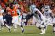 BLACKSBURG, VIRGINIA - NOVEMBER 17: Quarterback Logan Thomas #3 of the Virginia Tech Hokies runs with the ball for a touchdown as defensive tackle Sylvester Williams #92 of the North Carolina Tar Heels chases at Lane Stadium on November 17, 2011 in Blacksburg, Virginia. (Photo by Geoff Burke/Getty Images)