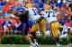 GAINESVILLE, FL - OCTOBER 06: Bennie Logan #18 of the LSU Tigers forces Jeff Driskel #6 of the Florida Gators to fumble during the game at Ben Hill Griffin Stadium on October 6, 2012 in Gainesville, Florida. (Photo by Sam Greenwood/Getty Images)