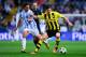 MALAGA, SPAIN - APRIL 03: Robert Lewandowski of Borussia Dortmund duels for the ball with Manuel Rolando Iturra of Malaga CF during the UEFA Champions League quarter-final first leg match between Malaga CF and Borussia Dortmund at La Rosaleda Stadium on April 3, 2013 in Malaga, Spain. (Photo by David Ramos/Getty Images)