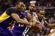 SAN ANTONIO, TX - APRIL 21: Kawhi Leonard #2 of the San Antonio Spurs reaches for the ball against Dwight Howard #12 of the Los Angeles Lakers during Game One of the Western Conference Quarterfinals of the 2013 NBA Playoffs at at AT&T Center on April 21, 2013 in San Antonio, Texas. NOTE TO USER: User expressly acknowledges and agrees that, by downloading and or using this photograph, User is consenting to the terms and conditions of the Getty Images License Agreement. (Photo by Ronald Martinez/Getty Images)