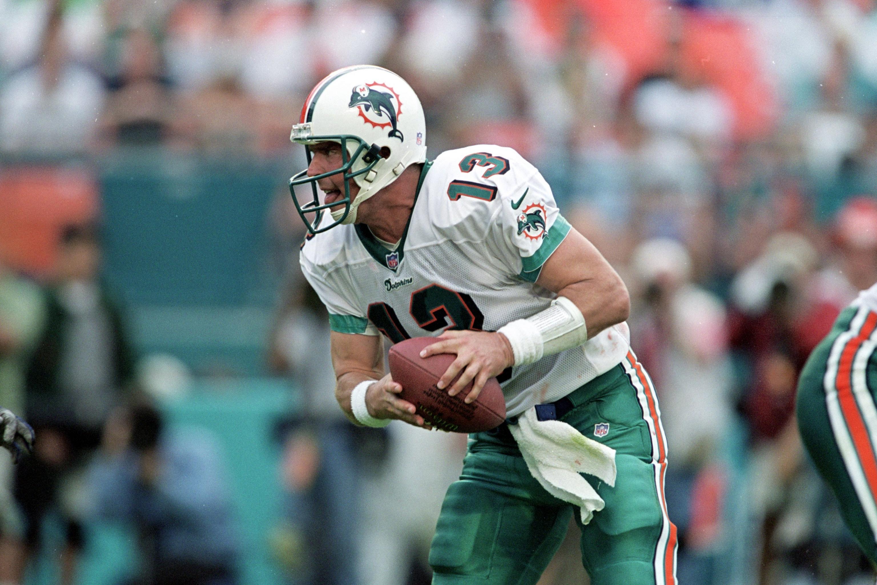 Dan Marino hands out Isotoner Slip-Ons as he is interviewed by