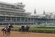 With the famous twin spires as a backdrop, a horse and rider work out before racing at Churchill Downs May 4, 2007 in Louisville. (Photo by A. Messerschmidt/Getty Images) *** Local Caption ***
