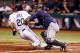 ST. PETERSBURG, FL - APRIL 06: Catcher Lou Marson #6 of the Cleveland Indians applies the tag to Matt Joyce #20 of the Tampa Bay Rays as he attempted to score on a first inning fly ball during the game at Tropicana Field on April 6, 2013 in St. Petersburg, Florida. (Photo by J. Meric/Getty Images)