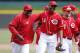 CINCINNATI, OH - APRIL 4: Manager Dusty Baker and Aroldis Chapman #54 of the Cincinnati Reds celebrate after the final out of the game against the Los Angeles Angels of Anaheim at Great American Ball Park on April 4, 2013 in Cincinnati, Ohio. The Reds won 5-4. (Photo by Joe Robbins/Getty Images)