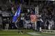Nov 09, 2012; East Hartford, CT, USA; Connecticut Huskies defensive end Trevardo Williams (48) and defensive tackle Ryan Wirth (53) carry flags onto the field before the start of the game against the Pittsburgh Panthers at Rentschler Field. UConn defeated Pittsburgh 24-17. Mandatory Credit: David Butler II-USA TODAY Sports